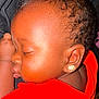 baby, sleeping, child, earring, red_shirt, curly_hair, closeup, face, peaceful, infant, skin, portrait, cute, adorable, resting, young_child, indoor, soft_light, head, person
