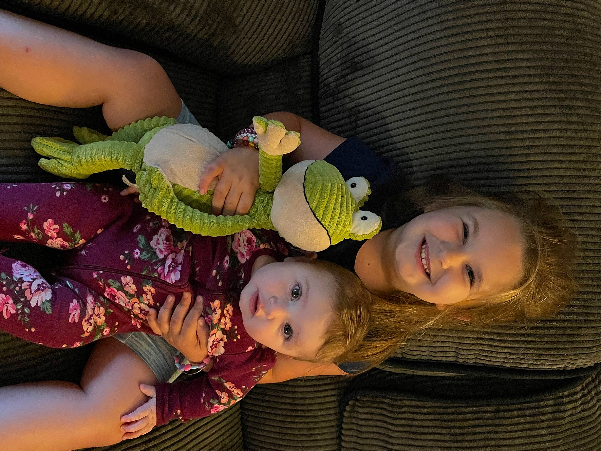 Ellie is registered to the contest to win money with this photo: baby, baby_products, baby_toddler_clothing, cheek, child, comfort, fashion_accessory, fun, happy, joy, leaf, pattern, person, smile, textile, toddler, wood