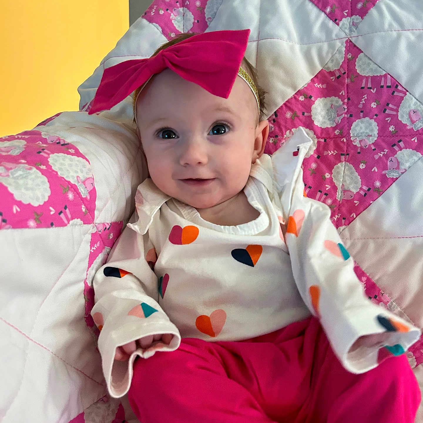 Maeve joined the competition — help win amazing prizes! baby, bed, bedroom, blanket, clothing, cushion, dress, face, furniture, hat, head, homedecor, indoors, people, person, photography, portrait, quilt, room, sitting