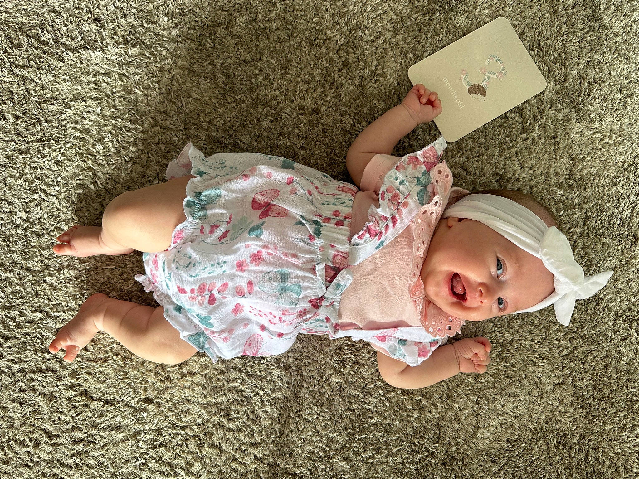 Aliana joined the competition — help win amazing prizes! baby, baby_toddler_clothing, child, comfort, finger, flooring, foot, fun, grass, happy, hat, headwear, human_leg, leg, pattern, person, pink, sitting, skin, sleeve