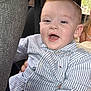 child, toddler, boy, striped_shirt, car_seat, smiling, happy, face, mouth_open, hair, clothing, interior, car, seatbelt, window, daylight, person, portrait, casual, cute