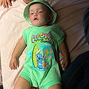 Kadence joined the competition — help win amazing prizes! baby, bed, cartoon, casual, child, clothing, cute, family, green, hand, hat, indoors, infant, legs, person, portrait, relaxed, skin, sleepy, surfboard