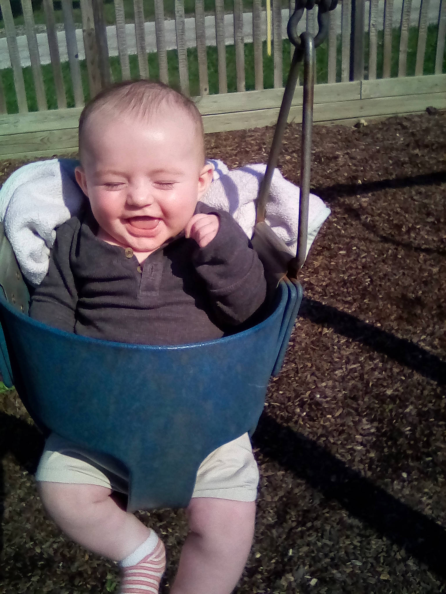 Nolan joined the competition — help win amazing prizes! baby, baby_toddler_clothing, child, eye, face, facial_expression, grass, happy, head, leisure, mouth, people_in_nature, person, recreation, sitting, skin, smile, swing, thigh, toddler