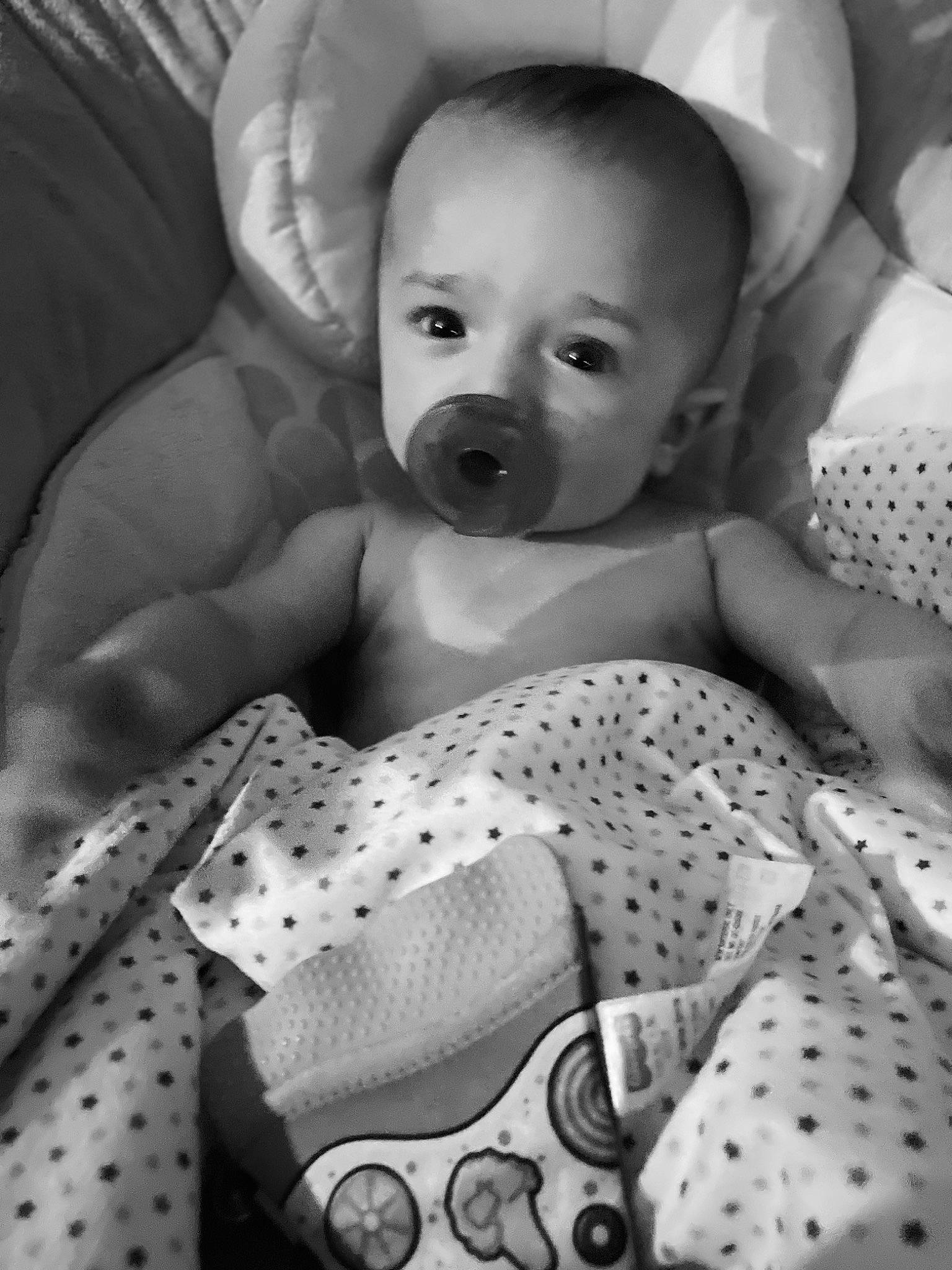 Asher is registered to the contest to win money with this photo: arm, baby, baby_toddler_clothing, black, black_and_white, comfort, hand, happy, head, iris, monochrome, monochrome_photography, organ, person, photograph, product, skin, smile, style, toddler