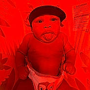 Johnathan is registered to the contest to win money with this photo: baby, infant, diaper, bonnet, tongue_out, playful, face, cute, child, patterned_background, owl_design, red_lighting, expression, skin, hand, lying_down, indoors, warning_label, fabric, closeup