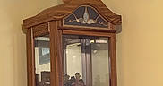 Punkie is registered to the contest to win money with this photo: animal, cabinet, cat, curiosity, domestic, figurines, furniture, glass_door, home_decor, household, indoor, looking_away, orange_cat, perched, pet, quiet, sitting, tabby_cat, wooden_cabinet, yellow_wall