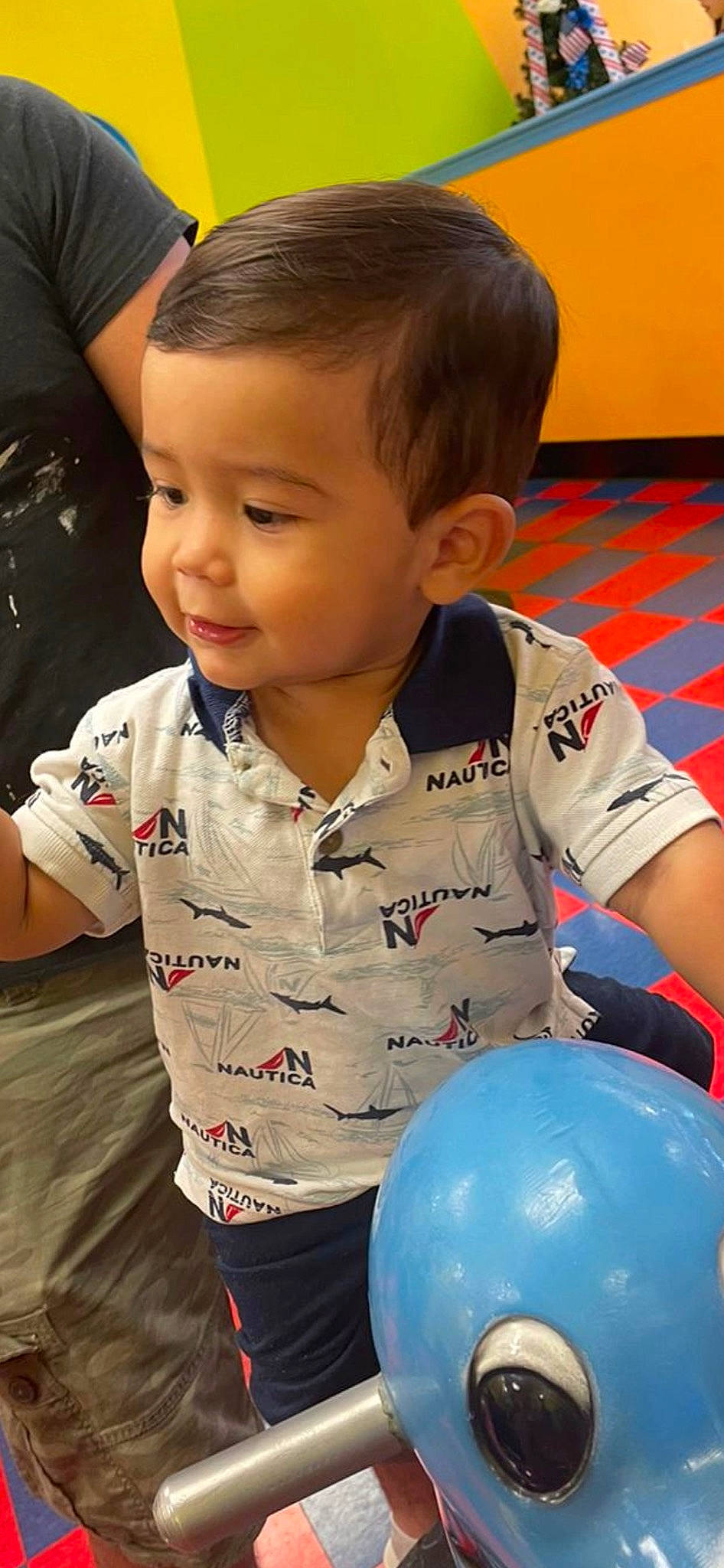 Jacob is registered to the contest to win money with this photo: baby_toddler_clothing, cheek, child, face, facial_expression, flooring, fun, hair, hairstyle, happy, head, iris, nose, person, photograph, skin, sleeve, smile, standing, thigh