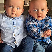 Mahdy Et Maloe a rejoint le concours — aidez-le/la à gagner de superbes lots ! baby, child, blue_eyes, casual_clothing, indoor, jeans, shirt, sitting, two_children, cute, portrait, home, furniture, lighting, curious_expression, infant, toddler, face, people, cozy