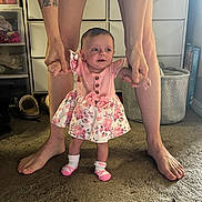 Emersyn joined the competition — help win amazing prizes! baby, child, person, hands, legs, feet, dress, floral_pattern, socks, carpet, storage_drawers, basket, indoor, natural_light, tattoo, floor, standing, support, curious, happy