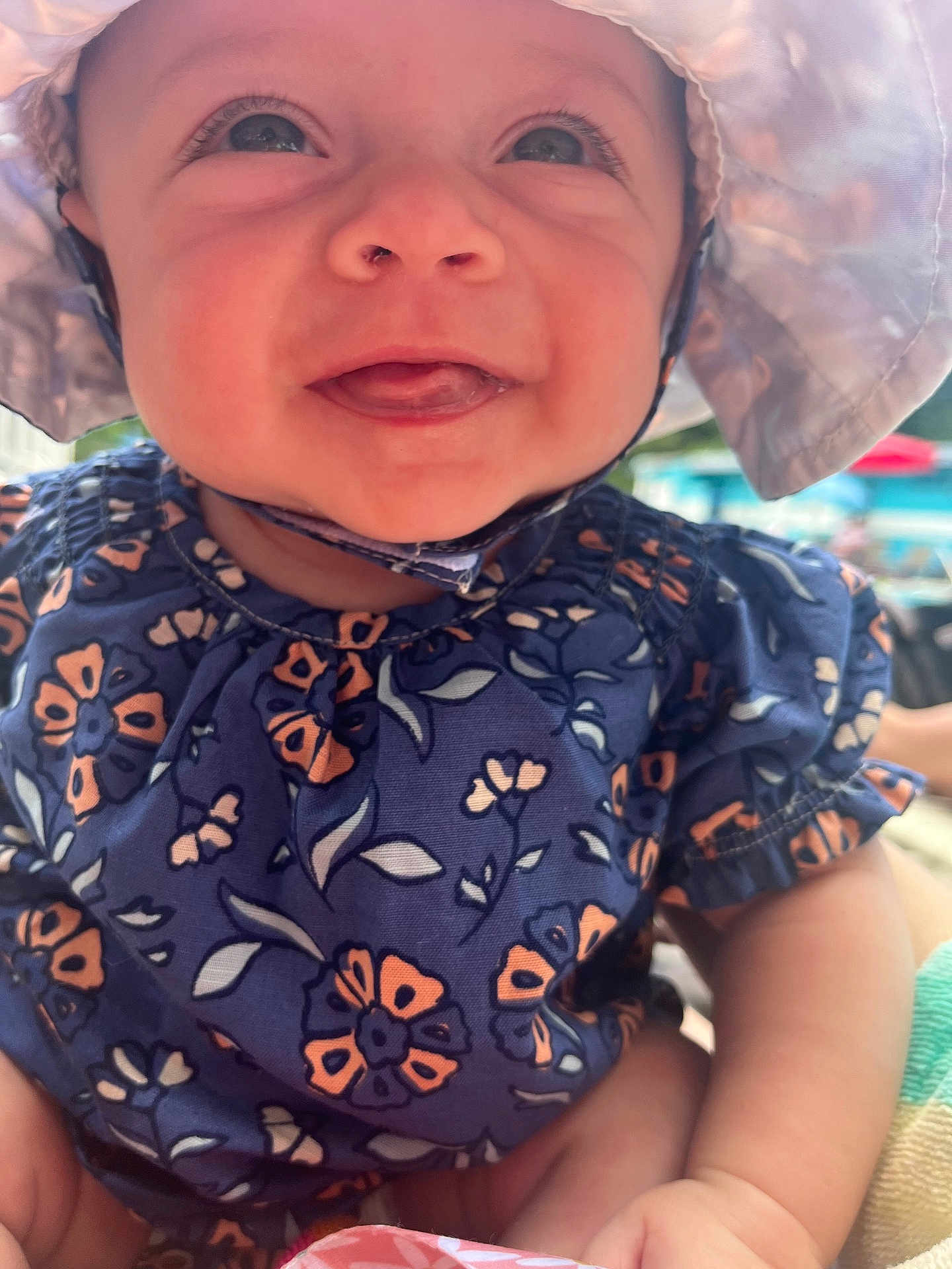 Emersyn joined the competition — help win amazing prizes! baby, child, smiling, hat, blue_clothing, floral_pattern, closeup, happy, outdoor, skin, face, cute, infant, sunhat, portrait, young_child, person, daylight, cheerful, wearing