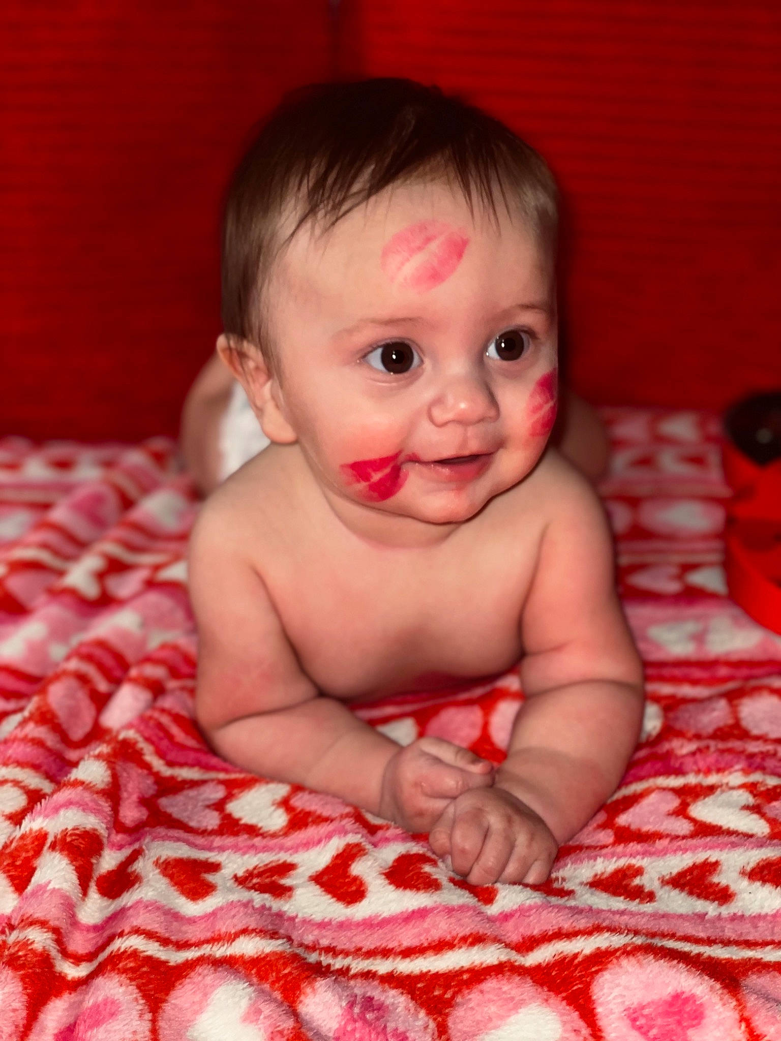 Branson is registered to the contest to win money with this photo: baby, baby_toddler_clothing, cheek, comfort, eye, finger, flash_photography, flooring, fun, happy, human_body, iris, lip, mammal, mouth, nose, person, pink, skin, smile