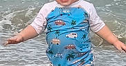 Kaison is registered to the contest to win money with this photo: toddler, child, beach, ocean, water, waves, swimsuit, blue, splashing, barefoot, happy, smiling, summer, outdoor, sand, playful, cute, person, vacation, nature