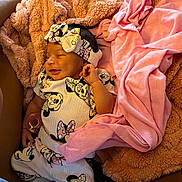Divinity joined the competition — help win amazing prizes! baby, smiling, infant, blanket, pink, clothing, headband, cute, sleepwear, person, soft, comfort, cozy, newborn, happy, lying_down, indoor, fabric, mickey_mouse, accessory
