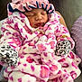 Divinity joined the competition — help win amazing prizes! baby, infant, sleeping, pink, blanket, mittens, bonnet, clothing, soft_fabric, leopard_print, cute, cozy, newborn, child, portrait, indoor, person, apparel, sleep, wrapped