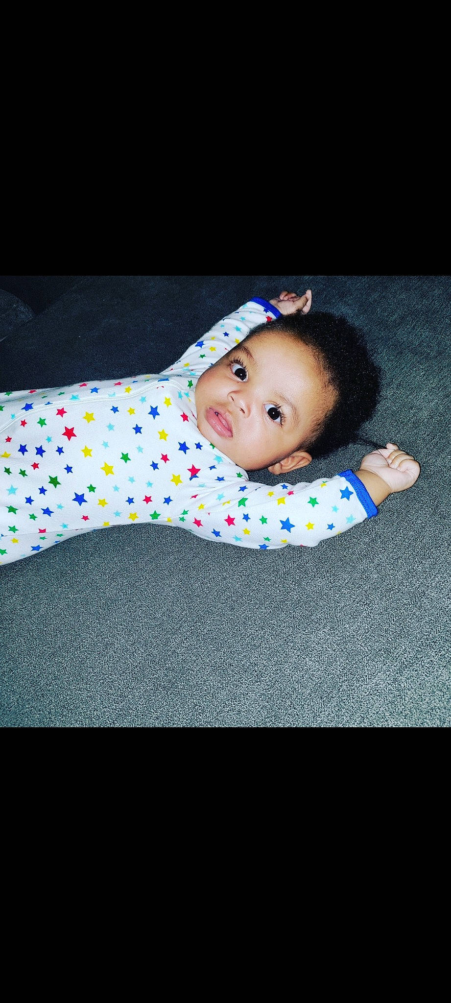 Macari is registered to the contest to win money with this photo: baby, baby_toddler_clothing, cheek, child, comfort, electric_blue, flash_photography, flooring, fun, grass, iris, linens, pattern, person, portrait_photography, sitting, sleeve, smile, toddler