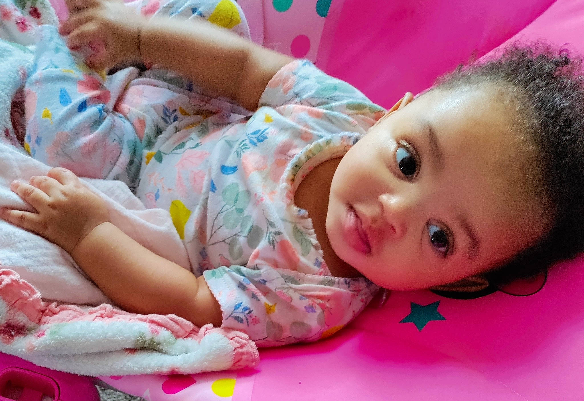 Macari joined the competition — help win amazing prizes! baby, baby_toddler_clothing, cheek, child, eyelash, facial_expression, flooring, fun, grass, happy, human, leisure, lip, nose, pattern, person, pink, room, sitting, skin