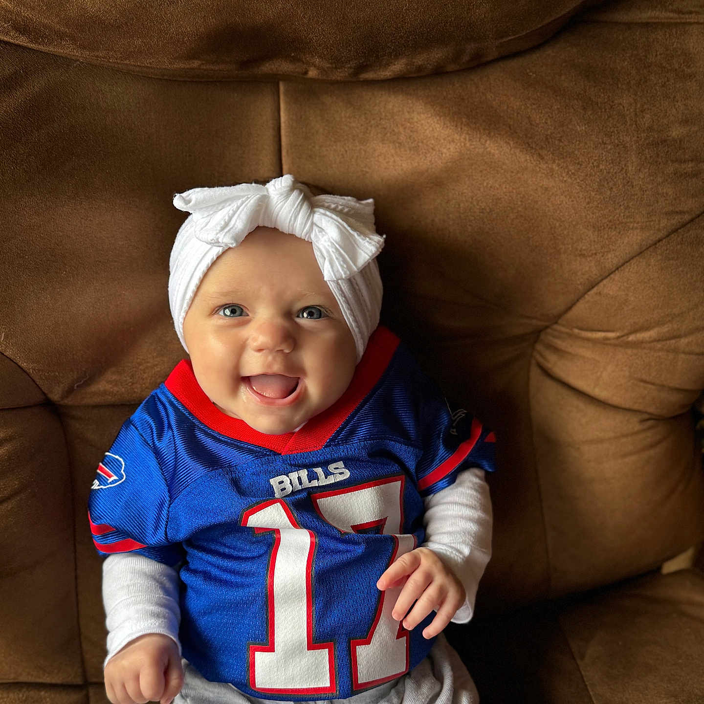 Callie joined the competition — help win amazing prizes! baby, babylaughing, cap, chair, clothing, couch, cushion, face, furniture, happy, hat, head, homedecor, pants, person, photography, portrait, sitting, smile, t_shirt