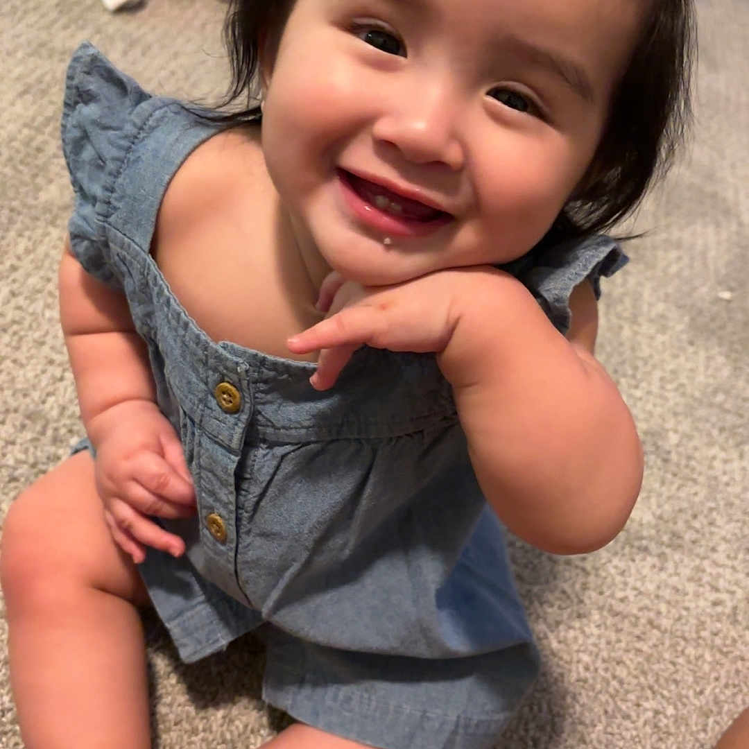 Naomi joined the competition — help win amazing prizes! accessories, baby, babylaughing, bodypart, clothing, dress, face, finger, hand, happy, head, jeans, laughing, pants, person, photography, portrait, shorts, sitting, smile