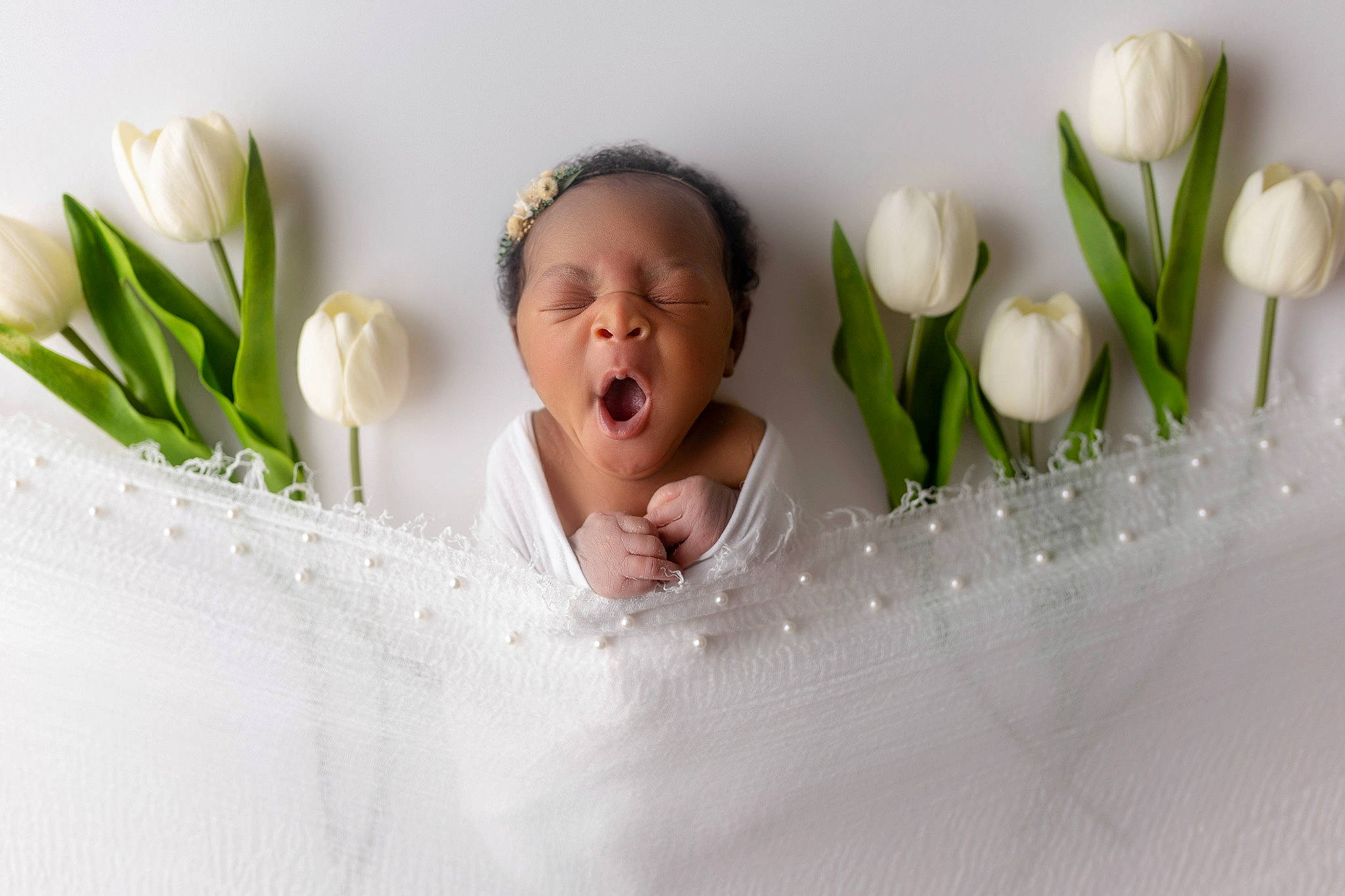 Saniya is registered to the contest to win money with this photo: artificial_flower, baby, bouquet, comfort, cut_flowers, facial_expression, finger, floral_design, floristry, flower, flower_arranging, flowerpot, gesture, hand, happy, headpiece, linens, person, petal, plant