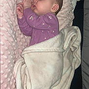Josetta is registered to the contest to win money with this photo: baby, sleeping, blanket, pacifier, pink, cozy, cushion, infant, soft, cute, child, portrait, resting, indoors, clothing, peaceful, toddler, face, hand, nap