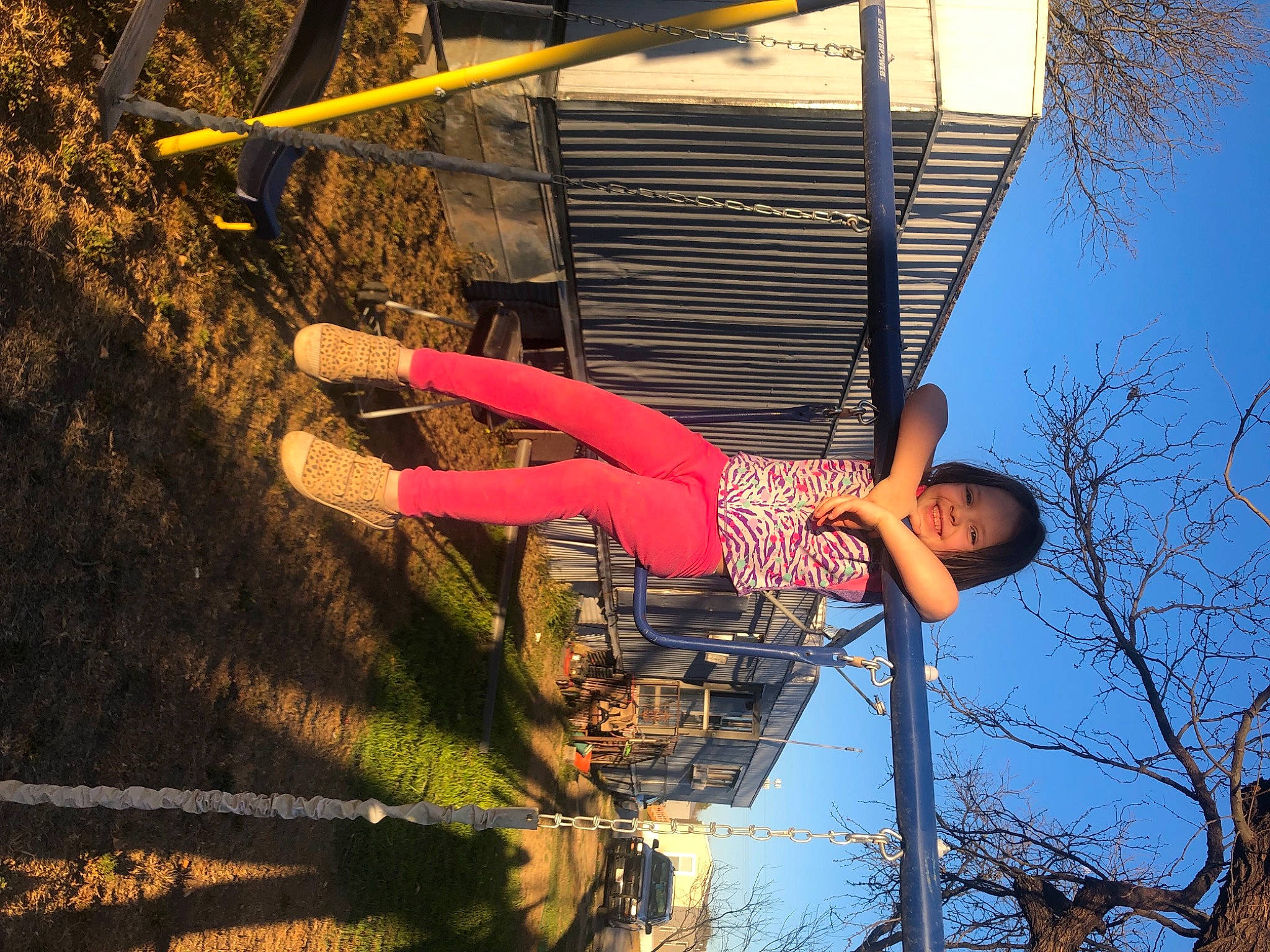 Alli Gator is registered to the contest to win money with this photo: electric_blue, flash_photography, fun, grass, happy, human_leg, joy, leg, leisure, line, magenta, people_in_nature, person, physical_fitness, recreation, shadow, sky, smile, thigh, tree