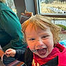 Kingslyn Kole is registered to the contest to win money with this photo: child, toddler, smiling, face_paint, messy_face, red_clothing, indoor, window, daylight, happy, laughing, person, curly_hair, table, chair, casual_clothing, fun, excited, portrait, closeup