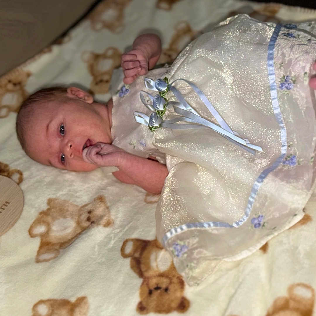Josefina joined the competition — help win amazing prizes! baby, newborn, infant, dress, blanket, teddy_bear, sign, one_month, lying_down, hand, foot, cute, child, portrait, indoors, soft_texture, milestone, celebration, sleepy, small