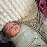 Josefina joined the competition — help win amazing prizes! baby, sleeping, swaddle, blanket, soft_texture, face, infant, cozy, bed, comfort, peaceful, rest, child, wrapped, indoor, cushion, pillow, relaxation, cute, portrait