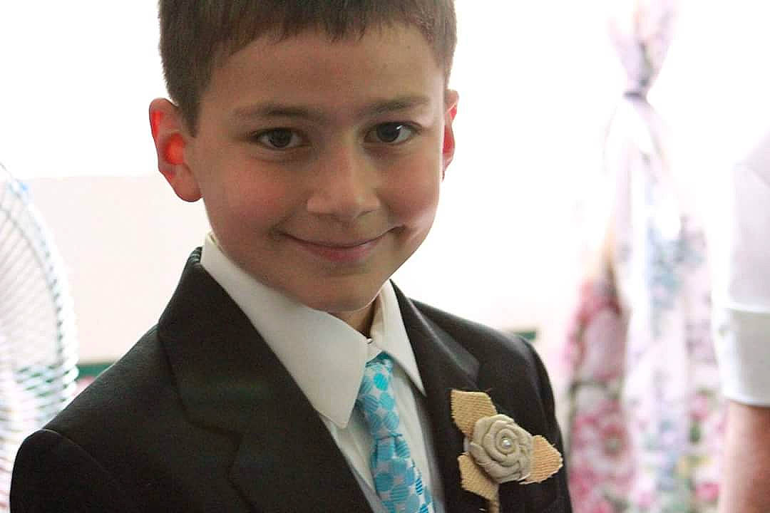 Aidan joined the competition — help win amazing prizes! child, formal_wear, joy, person, smile, suit, white_collar_worker