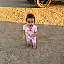 boots, casual_wear, child, daytime, dirt, expression, happy, looking_up, outdoor, pink_clothing, shadow, short_sleeves, standing, striped_pants, sunlight, toddler, truck, vehicle, wheel, young_child