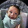 Dj joined the competition — help win amazing prizes! baby, blanket, child, face, hand, smile, wrapped, cozy, soft, texture, curious, indoor, portrait, infant, cute, warm, person, young, expression, clothing