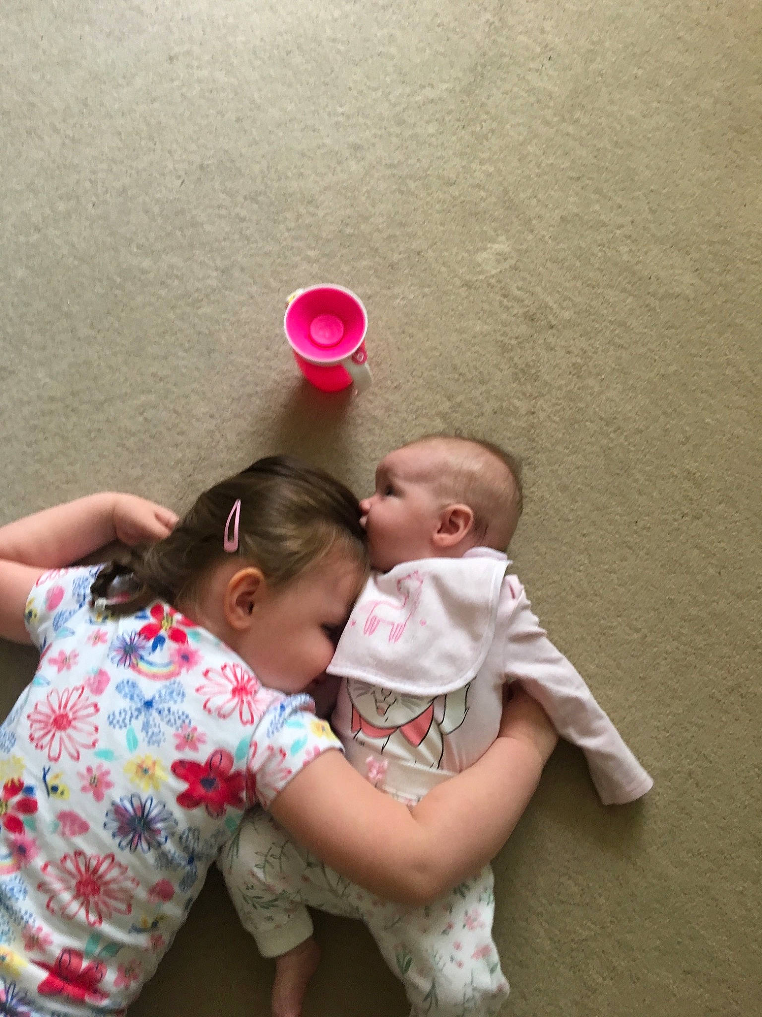 Marie is registered to the contest to win money with this photo: arm, baby, child, daughter, fun, gesture, happy, leg, love, mother, person, pink, play, sibling, sitting, skin, smile, toddler