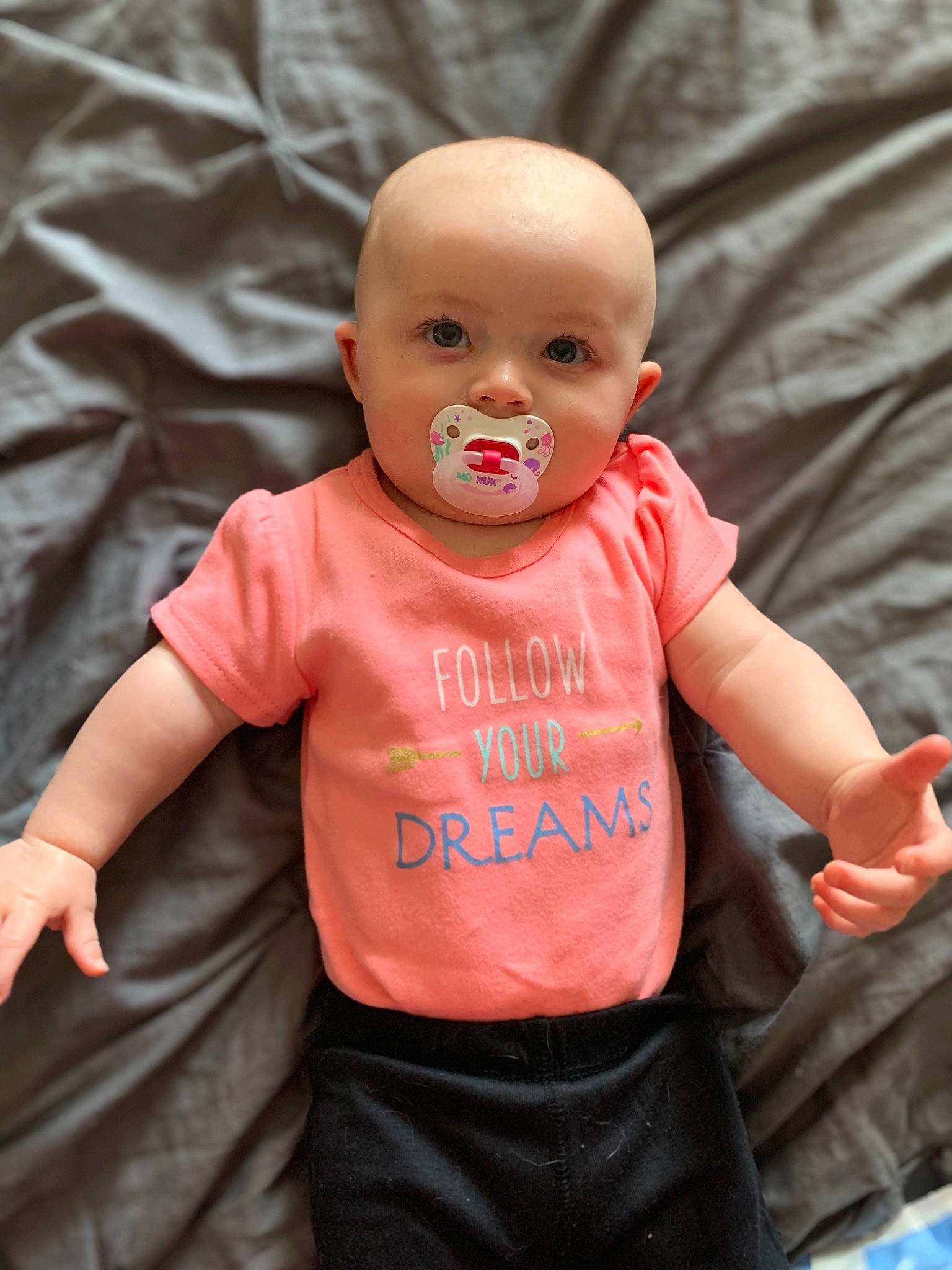 Amelia is registered to the contest to win money with this photo: baby, baby_toddler_clothing, cheek, child, face, head, person, pink, skin, smile, t_shirt, toddler