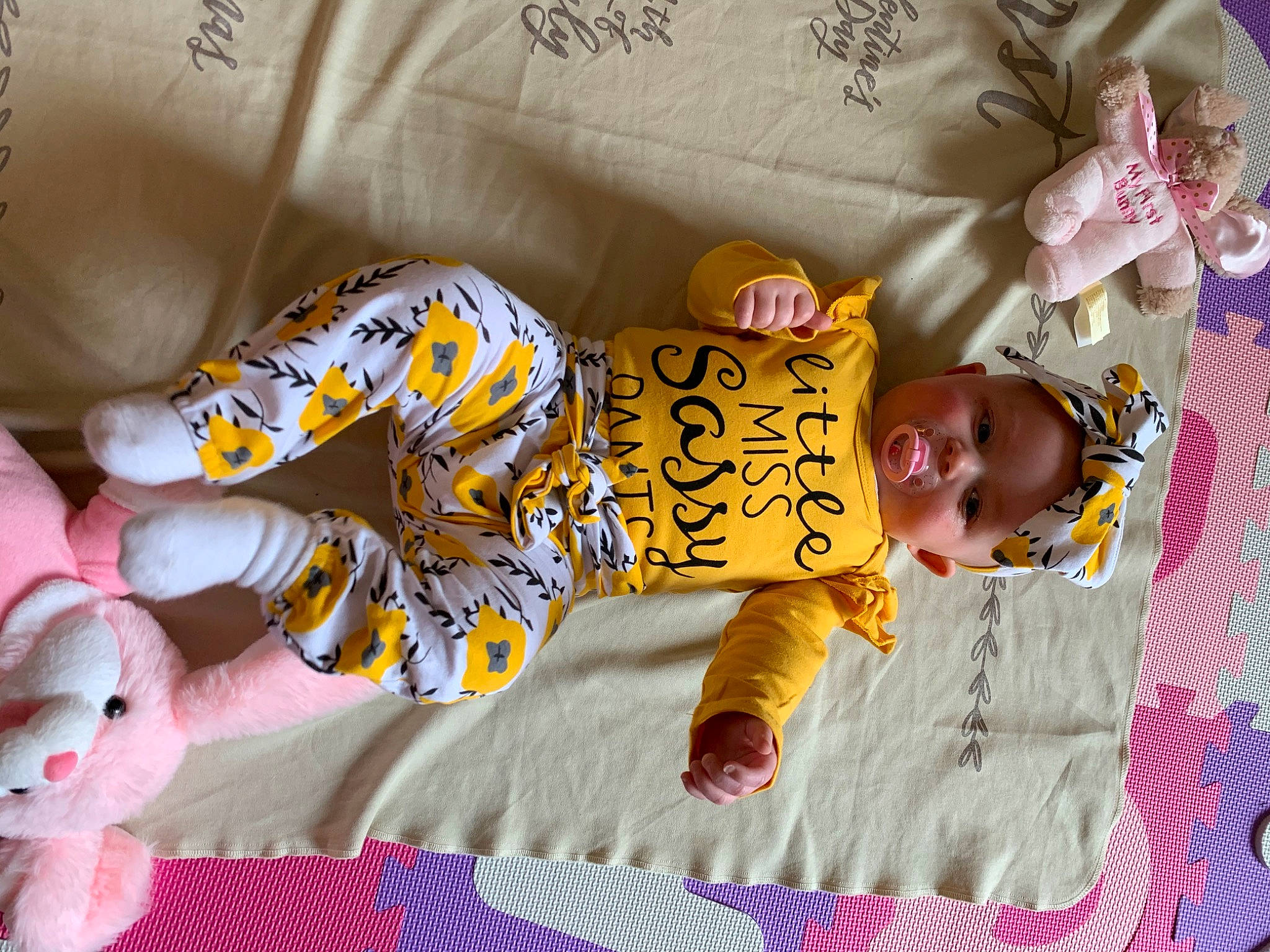Amelia joined the competition — help win amazing prizes! baby, baby_products, baby_toddler_clothing, baby_toys, bed_sheet, child, headwear, linens, nap, pajamas, person, product, room, textile, toddler, yellow