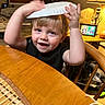 Dryker joined the competition — help win amazing prizes! blond_hair, blue_eyes, chair, child, cute, face, furniture, happy, hat, home_interior, indoor, lamp, paper_plate, person, playful, portrait, smiling, table, toddler, wooden_table