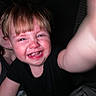 Dryker is registered to the contest to win money with this photo: child, toddler, smiling, selfie, face, person, happy, indoor, dark_background, casual_clothing, adult, blond_hair, short_hair, portrait, close_up, reaching_hand, human, skin, expression, joy