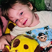 Dryker joined the competition — help win amazing prizes! child, smiling, blanket, tshirt, cartoon, bear, glasses, colorful, cozy, cute, indoor, portrait, head, face, happy, young, person, plush, comfort, relaxed