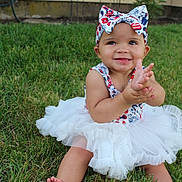 Trinity is registered to the contest to win money with this photo: baby, child, grass, tutu, headband, bow, smiling, clapping, outdoor, garden, fence, barefoot, cute, happy, summer, dress, person, infant, nature, playful