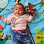 baby, bed, blanket, clothing, face, footwear, furniture, head, hosiery, jeans, pants, person, photography, portrait, quilt, shoe, shorts, sock, t_shirt, toy