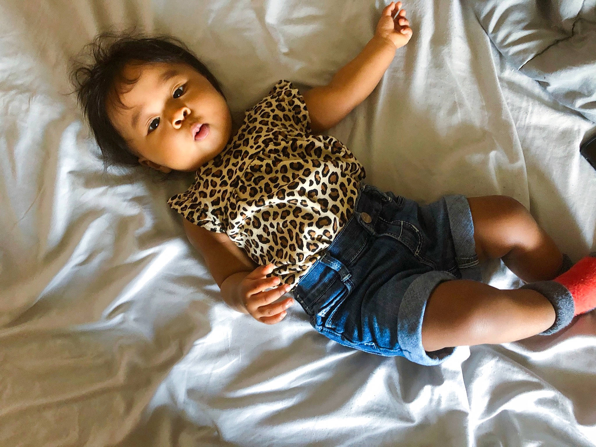 Kaiya joined the competition — help win amazing prizes! baby, baby_toddler_clothing, bed, child, comfort, elbow, eye, happy, head, human_leg, joint, knee, linens, person, skin, sleeve, sock, textile, thigh, toddler