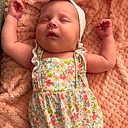 Aubriella is registered to the contest to win money with this photo: baby, sleeping, infant, floral_outfit, headband, bunny_ears, blanket, soft_texture, peaceful, cute, newborn, child, pink, arms_up, closeup, portrait, resting, indoors, skin, hand