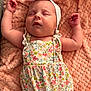 baby, sleeping, infant, floral_outfit, headband, bunny_ears, blanket, soft_texture, peaceful, cute, newborn, child, pink, arms_up, closeup, portrait, resting, indoors, skin, hand