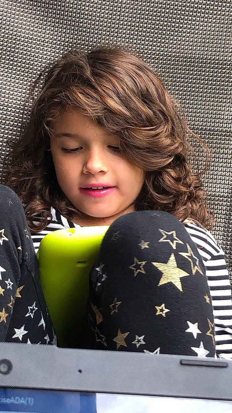 Fatima is registered to the contest to win money with this photo: brown_hair, child, child_model, hair, hairstyle, person, smile