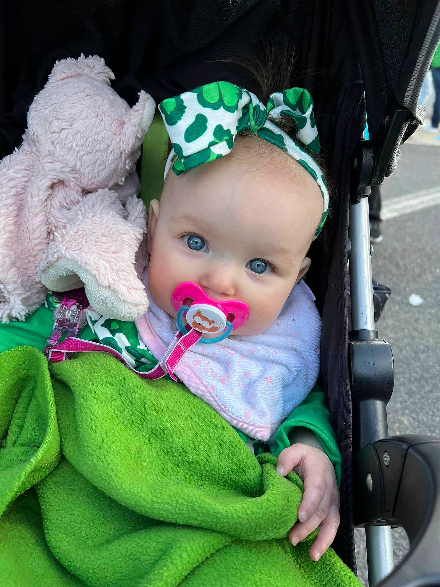Cassidy is registered to the contest to win money with this photo: baby, baby_carriage, baby_products, baby_toddler_clothing, cap, cheek, child, event, fashion_accessory, fun, grass, green, happy, headband, jewellery, person, product, sitting, toddler, wool