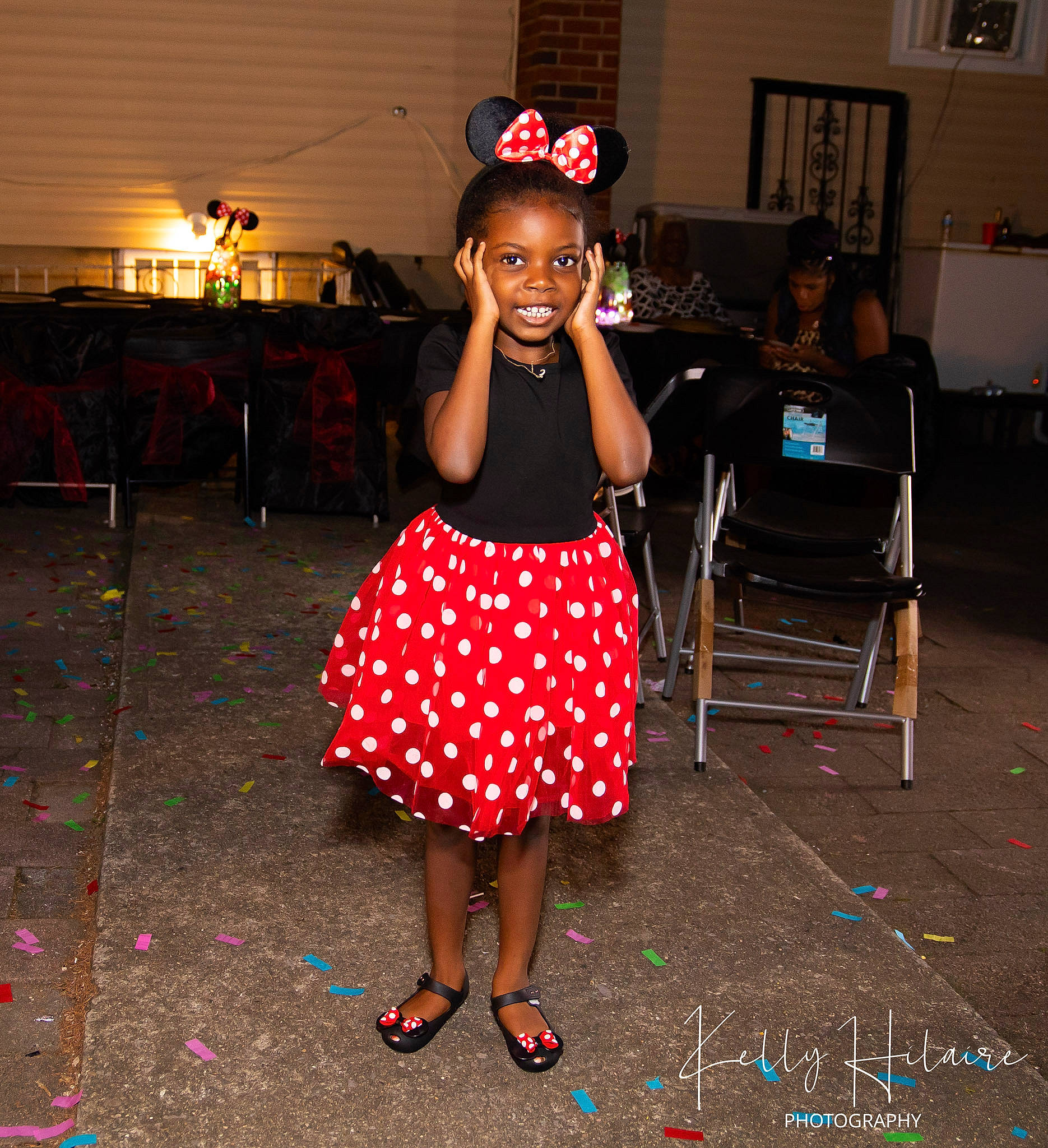 Aisha is registered to the contest to win money with this photo: chair, child, entertainment, event, fashion_design, flooring, fun, happy, hat, holiday, joy, magenta, one_piece_garment, party, party_supply, pattern, performing_arts, person, smile, standing