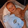 Milo is registered to the contest to win money with this photo: baby, bed, blanket, bodypart, couch, cradle, crib, cushion, face, finger, furniture, hand, happy, head, infantbed, newborn, person, photography, portrait, smile