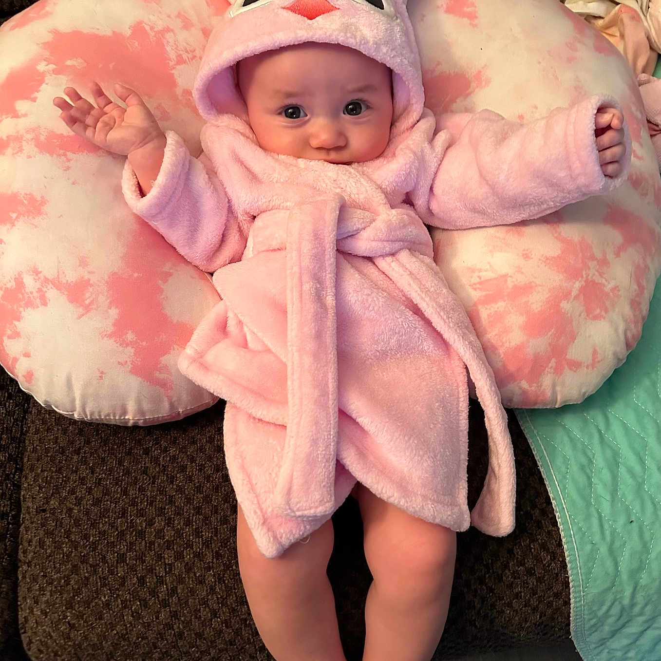 Gia is registered to the contest to win money with this photo: baby, blanket, bonnet, clothing, couch, cushion, face, fashion, furniture, hat, head, homedecor, newborn, person, photography, portrait, robe, sitting, sleeve, toy