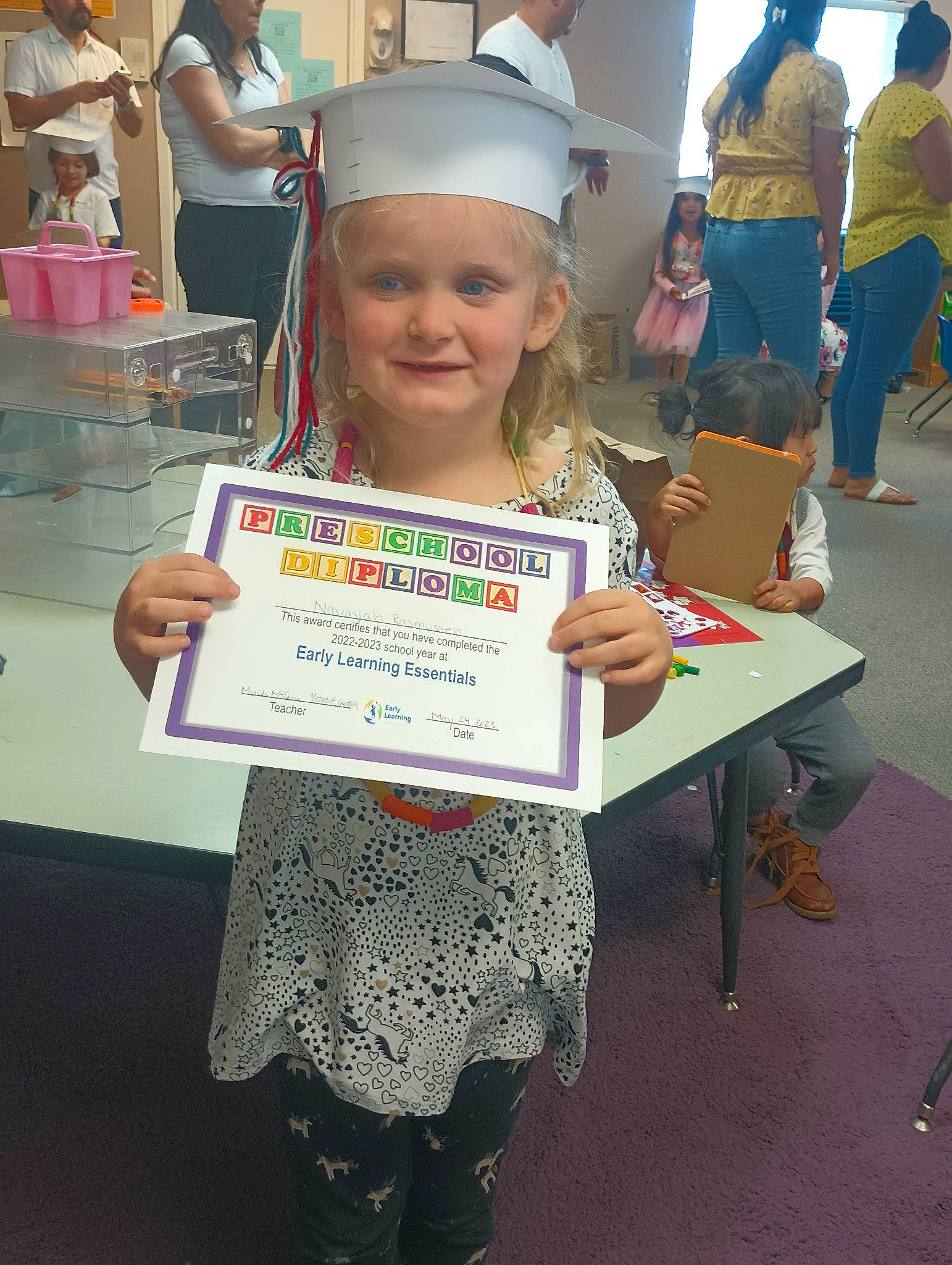 Navayah joined the competition — help win amazing prizes! academic_institution, chair, child, class, costume, education, event, face, fashion_design, flooring, fun, hair, headwear, joy, person, recreation, room, school, smile, t_shirt