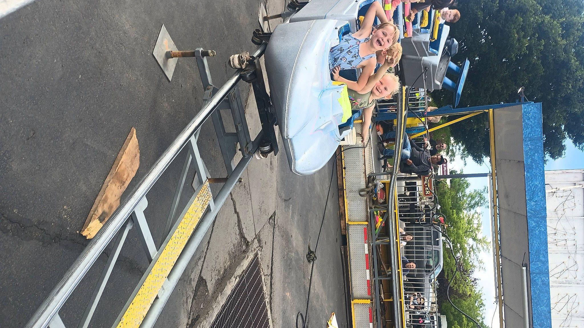 Lakayla is registered to the contest to win money with this photo: asphalt, auto_part, automotive_exterior, automotive_wheel_system, boat, boats_and_boating_equipment_and_supplies, city, electricity, facade, joy, motor_vehicle, naval_architecture, pedestrian, person, plant, public_utility, recreation, tree, urban_design, vehicle