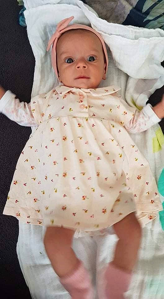 Keyla a rejoint le concours — aidez-le/la à gagner de superbes lots ! arm, baby, baby_toddler_clothing, comfort, day_dress, dress, eye, face, hand, linens, lip, nose, one_piece_garment, person, photograph, pink, skin, sleeve, textile, toddler